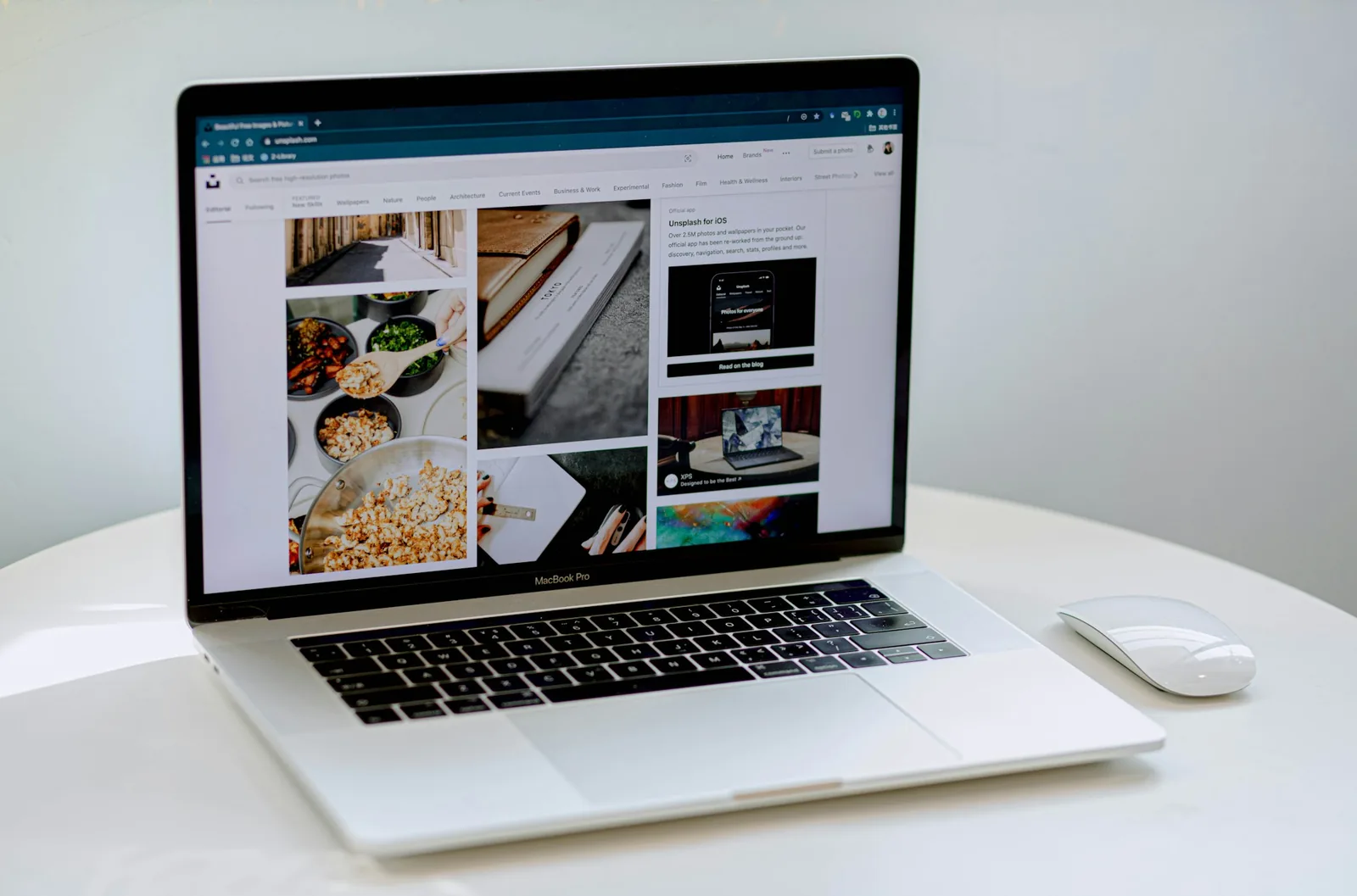 Ecommerce workspace with an open laptop on a white desk